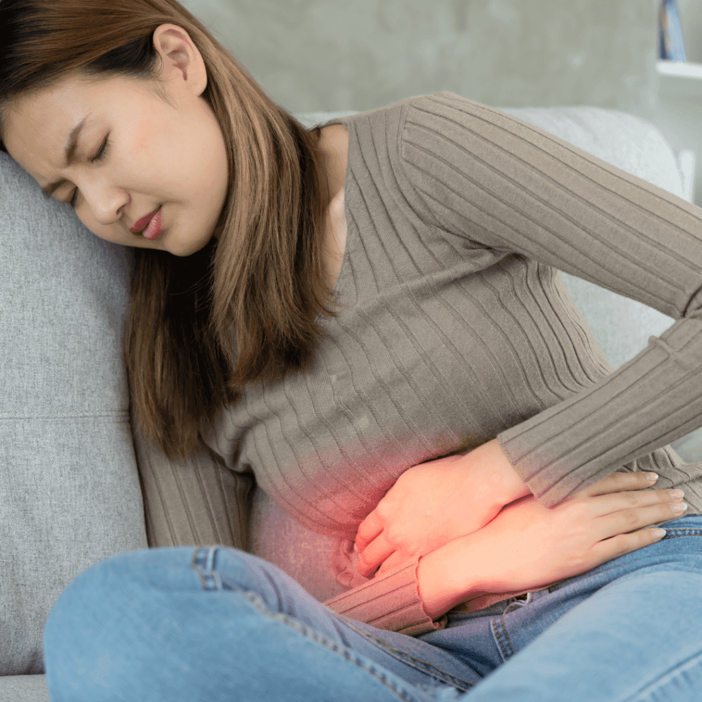 perempuan yang sedang sakit asam lambung